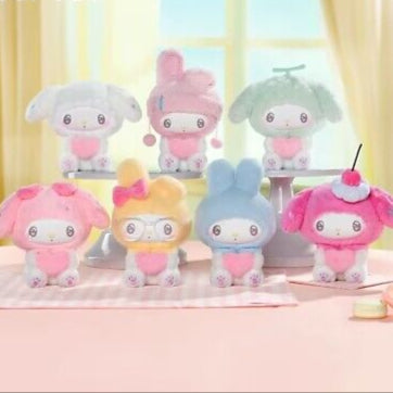 Collection of colorful plush toys with 'My Melody' character on a light pink surface.