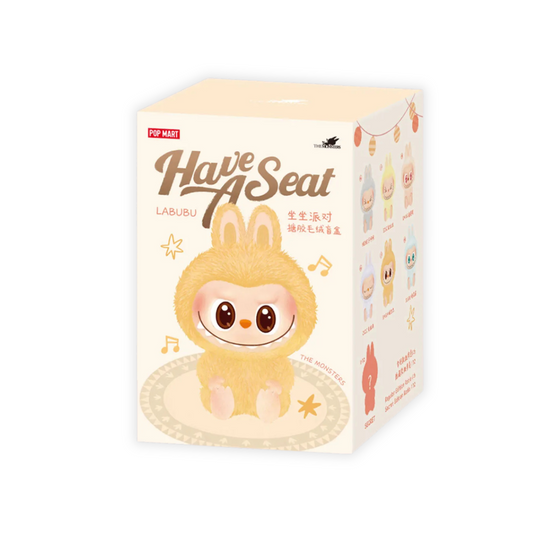 A product image of the Pop Mart "Have A Seat" Labubu blind box. The packaging features a cute, round character with a fluffy yellow bunny suit, large eyes, and a wide smile, seated on a decorative mat with musical notes and stars. The design has a soft pastel aesthetic. The right side of the box displays various collectible figure options in the series, each in different pastel colors. The branding includes the Pop Mart and The Monsters logos, along with stylized text in both English and Chinese.