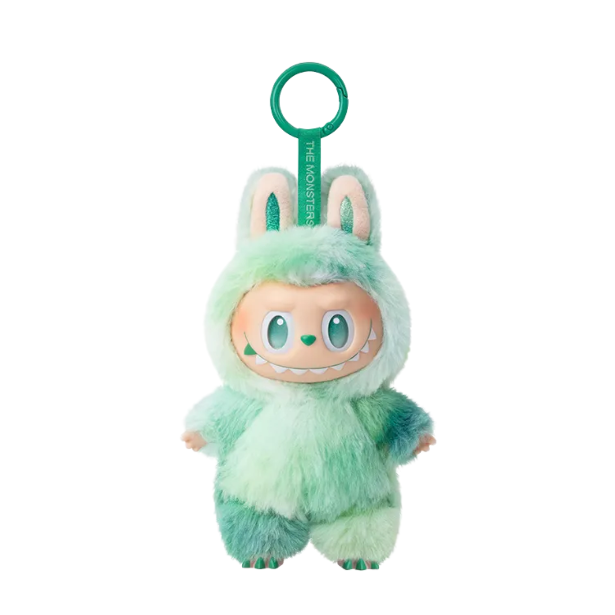 A plush keychain figure from Pop Mart’s “The Monsters” Labubu series. The character is wearing a fuzzy dark and light green bunny suit with tall ears and a matching pink keychain strap labeled “THE MONSTERS.” It has striking red eyes and a mischievous toothy grin, giving it an energetic and bold appearance. The plush texture and bright color scheme make this figure both cute and fierce, perfect for collectors who enjoy vibrant and expressive designs.